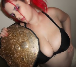 rebelfairy posing with a wrestling belt