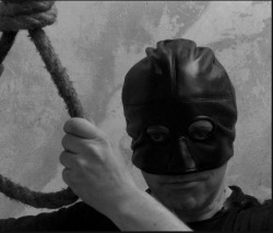 Hans wears a mask for Public Executions. Maria, his next victim, is made to remove all her clothing before he places the noose around her neck.