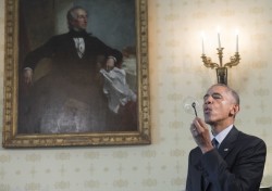 US President Barack Obama blows a bubble using a bubble wand created with a 3D printer as he tours the 2016 White House Science Fair in the Blue Room at the White House in Washington, DC, April 13, 2016.