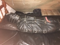 jamesbondagesx:  Gimp in full rubber, rubber hood, leather gimp hood, leather sleepsack roped up tight and milked 
