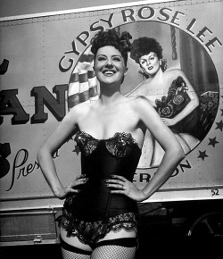  Gypsy Rose Lee   (aka. Louise Hovick) Vintage candid photo features Gypsy posing in front of a trailer from her 1949 ‘Royal American Shows’ travelling tent show.. ‘Royal American’ was one of the longest-running Carnival circuit burlesque shows..
