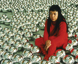  Yayoi Kusama sitting in Narcissus Garden in 1999 