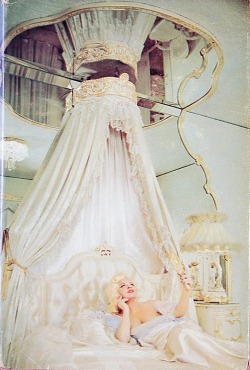 dollpeach:  Mae West reclines on a typically understated bed on 