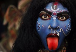 unruly-like-my-hair:       &quot;A woman elaborately made up to look like the Hindu goddess Kali joins the procession in the Indian city of Allahbad&quot;       Content source: Maha Shivaratri Hindu festival sees revellers take to streets of India
