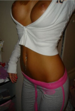 thegoodsmut:  the near perfect body - flat stomach, hot tan, belly ring, fake tits, ass in yoga pants so its easy to grind and easy for her to feel my hard on pulsating against her 