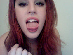 I rarely see anyone besides myself that can do this with their tongue.  Unrelated, I have always thought that septum piercings on women were sexy as hell, or at least tasteful ones such as this.