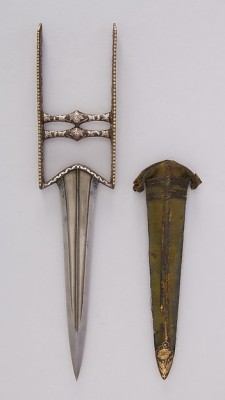 art-of-swords:  Katar Dagger with Sheath Dated: 18th–19th century Culture: South Indian, possibly Deccan Medium: steel, gold, silver, velvet, iron Measurements: L. with sheath 14 5/16 in. (36.4 cm); L. without sheath 14 in. (35.6 cm); W. 3 1/16 in.