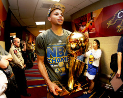 celebritiesofcolor:  Stephen Curry #30 of the Golden State Warriors celebrates with the Larry O'Brien NBA Championship Trophy after defeating the Cleveland Cavaliers in Game Six of the 2015 NBA Finals