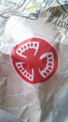So, I know McDonalds intended for this to be a nice, fresh, cross section of a tomato, but it looks more like three sets of vampire teeth, like, McDonalds you&rsquo;ve got like a vampire gang symbol on your takeout bags