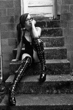 Skyyylineeeeee has mile long thigh high boots in this black and white shot