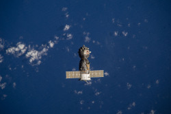 humanoidhistory:  Russia’s Soyuz TMA-10M spacecraft heads toward Earth, as observed from the International Space Station on March 11, 2014. The cargo was spacemen Mike Hopkins, Oleg Kotov, and Sergey Ryazanskiy, returning home after a 166-day stint