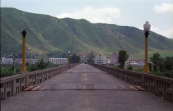komalantz:  Tumen River Bridge by Ray Cunningham on Flickr.Via Flickr: 35mm Kodak Ektar 100 film taken with a Pentax K-1000. Looking toward North Korea. I was walking into the DPRK. This was taken near the Korean side. 