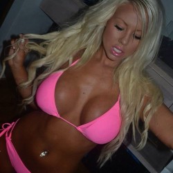 faketitsfuckdolls:  Amanda Breden This picture, although it’s an amateur shot, is beautifully composed imo. The contrast of Amanda’s platinum blonde hair against her evenly tanned skin is sensational, as always, but with the bright girly pink of her