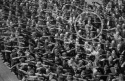 Alone man refusing to do the “Sieg Heil” salute at the launching of the Horst Wessell in Nazi Germany, 1936.