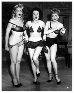      COSTUME ADJUSTMENTS.. Jennie Lee (at Left) is featured with good friends: Pat Flannery (middle) and Doreen Gray, in a publicity photo for the 1951 Burlesque film: &ldquo;DING-DONG! A NIGHT in the MOULIN ROUGE&rdquo;.. It was a documentary-style recor