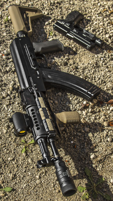 theairsoft:  airsoftmedia:  Bob’s AK &amp; Sidearm Wallpaper  Oh so pretty guns! 