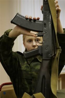 gunrunnerhell:  Better than Barbies… Svetlana Grigoryeva learns to disassemble and re-assemble a Kalashnikov rifle during a lesson at the cadets’ boarding school No. 9 for girls in Moscow, Nov. 26, 2005. The school offers its pupils a strong spirit