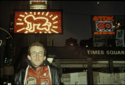 twixnmix:  Keith Haring’s in front the Spectacolor Billboard showcasing his signature Radiant Baby in Times Square, January 1982.  Keith Haring: Messages to the Public was on view Jan 1, 1982 – Jan 31, 1982.