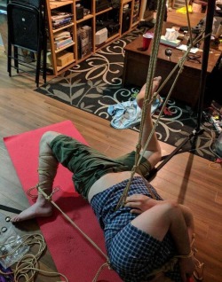theropegeek:  Me, sadistically tied  That line coming off of my left ankle was actually a predicament which wrapped around my neck in a choking way.  Don’t try this at home.  Rope and Photo by Nerdcore Becca