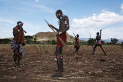   Ethiopia’s Omo Valley, by Olson and Farlow    Whipping Women at Bull Jumping: At the beginning of a manhood ceremony, women blow little horns begging and intimidating men to whip them. Women are left scarred but it is their symbol of belonging to