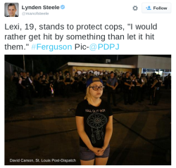 secondaryartifacts:  codyjohnston:  Some headlines for tomorrow:“Young Woman In T-shirt Protects Cops Who Are Wearing Bullet Proof Vests And Riot Gear”“Cops Wear Riot Gear To Prepare For Violence From Protesters Then Just Allow Random Young Woman