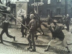 sonounsoffione:A woman hitting a neo-nazi with her handbag, Sweden, 1985. The woman was reportedly a concentration camp survivor.