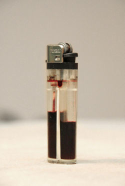 please-nigga-im-a-hot-mess:     Transparent lighter filled with blood  Visit me. http://please-nigga-im-a-hot-mess.tumblr.com/