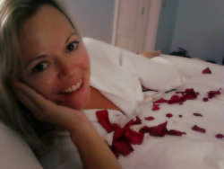 AngelWinters in bed with rose petals