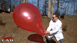 pizzaotter:chibi-masshuu:fencehopping:Giant balloon popping in slow motion.  Blood bending is real.  This is the coolest thing ever.