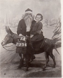 ancientfaces:  Christmas with Santa Claus in 1922 Not much information is known about this Christmas photo, but we thought too great not to share! Taken December 5th in 1922. [ Original: 1922 Santa Claus Christmas ] 
