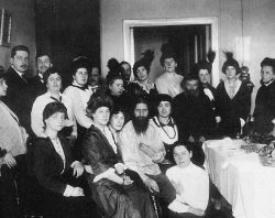 Rasputin in his salon among admirers early 1914, most likely on his birthday; his father is the 4th from the right. His telephone is visible on the wall. Photo by Karl Bulla.