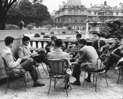  Students from the Sorbonne sit around a table in the Jardin du Luxembourg, c. 1950 