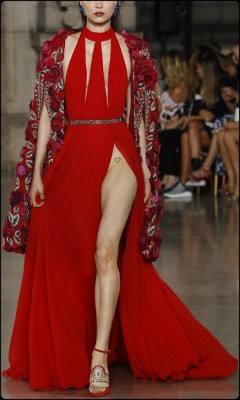 modern-air-travel:  cosmicheartt: Roses of Red Georges Hobeika  A dramatic dress! And I love how that leg slit reveals such a flirty tattoo and teases the idea that the model isn’t wearing panties. Well, if this was my Baby Girl, there’d be no question