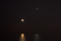 just&ndash;space:  Reflections of Venus and Moon : Posing near the western horizon, a brilliant evening star and slender young crescent shared reflections in a calm sea last Thursday after sunset. Recorded in this snapshot from the Atlantic beach at Santa