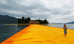 archatlas:  Walking on Water Christo’s ‘Floating Piers’ installation finally opens to the public June 18th.    The highly-anticipated reveal sees 100,000 square meters of shimmering yellow fabric wrap a floating dock that connects various points