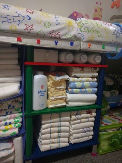 abcubs:  Restocking the changing table for a new week. 