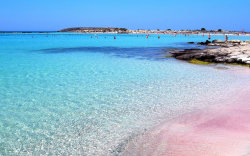 sixpenceee:  Elafonisi Beach located in Crete, Greece. It has clear, turquoise waters have beckoned travellers for centuries and pure white sandbars. In some light, the sand takes on a pink glow, said to be from broken corals. (Source)