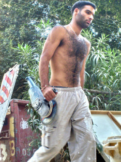arabiandelights:  Arab laborer  A very handsome, hairy, sexy looking man.  Would love to run my hands through his chest hair.  WOOF