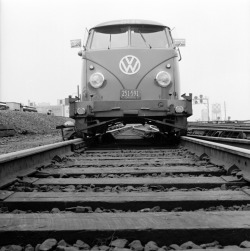 The new Volkswagen travelling along the tracks of the Long Island railroad. This versatile vehicle has two sets of wheels, tyres for the road and iron wheels that fit directly onto the tracks, 1956.  