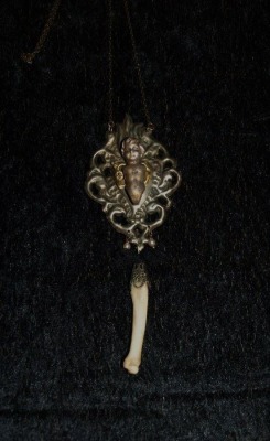 Mourning jewelry containing a finger bone from the deceased.