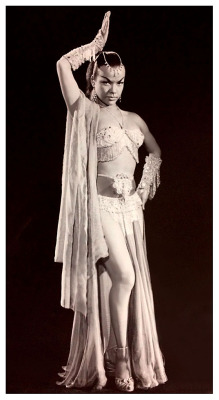A publicity still from the 1955 film: “Son Of Sinbad”, shows dancer Nejla Ates modelling the conservative costume featured in her dance sequence.. Due to differing obscenity laws across North America (and Internationally), film studios still forced