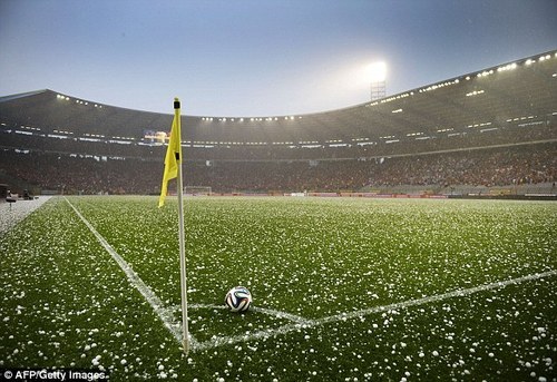 Hail littering the soccer field in Brussels (Source: AFP/Getty Images)