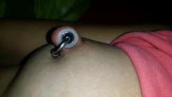 nippleringlover:  4mm steel ring, in 8mm steel tunnel, in 10mm silicone tunnel, makes an 11.3mm stretched nipple piercing hole. enjoy !!!