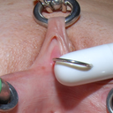 pussymodsgaloreThis is Vinam with a trailer to one of her many videos. Notice in particular that she has a large ring actually through her pierced clit. (Many so called clit piercings are in fact through the clit hood.) E-stim electric impulses are delive