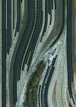 dailyoverview:  Train cars filled with coal are stationed in Norfolk, Virginia. Operated by the Norfolk Southern corporation, Lamberts Point Pier 6 is the largest coal-loading station in the Northern Hemisphere and serves at the temporary depot for the