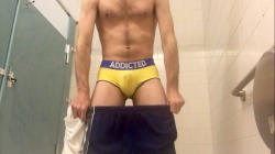 somewetguy:  Piss soaking some yellow briefs in a public  bathroom.   HOT! Yellow on yellow