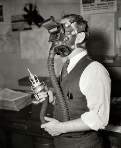 Protection against that dreaded disease Silicosis is assured underground workers with this new sand-blasting helmet developed by William P. Biggs, Safety Engineer of the Navy Department, 1936.