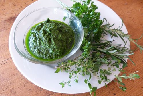 fresh herb rub with finely processed herbs in bowl