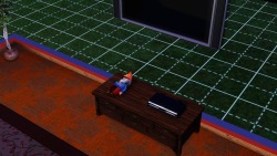 One of my Sims kicked over Siddhartha, my mysterious little gnome, stood him up, and then he was doing a handstand. Then at about 3am, he disappeared in a little puff of orange smoke and sparkles, and after some searching, I found him like this -  taking