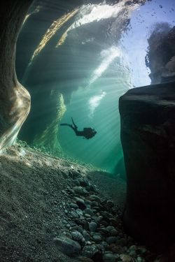 lifeunderthewaves:   Diving in Verzasca River   Diver in crystal clear water of Verzasca river in Ticino - Switzerland. This dive site is dangerous if you don’t respect the security rules. But it’s a fabulous world with rounded rock. You can see across